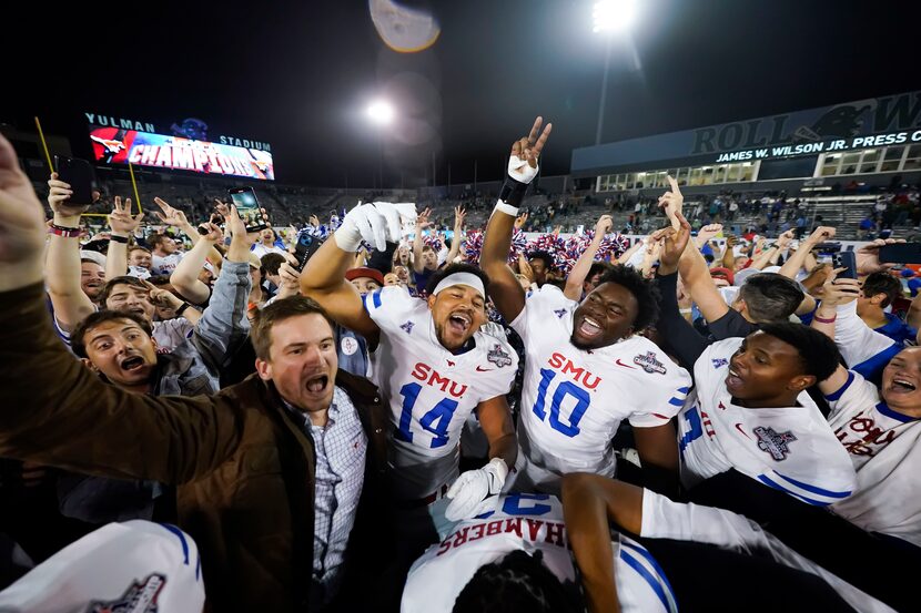 SMU tight end Nolan Matthews-Harris (14) and defensive end David Abiara (10) celebrate after...