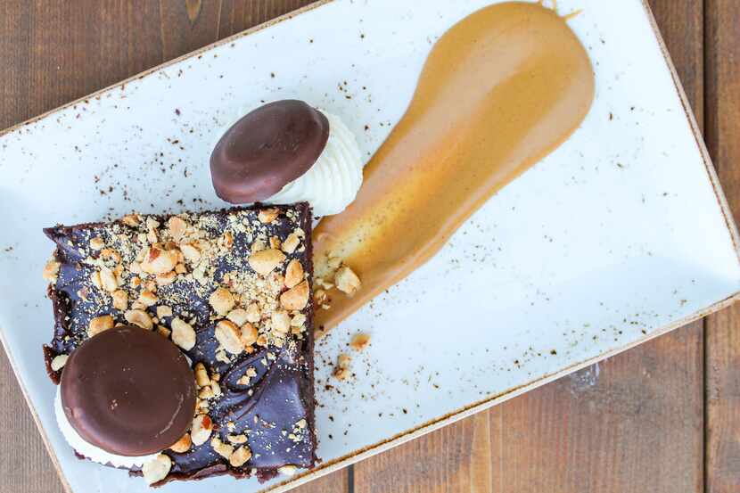 Peanut Butter Texas Sheet Cake is made with Tagalongs at Texas Spice at the Omni Dallas. All...