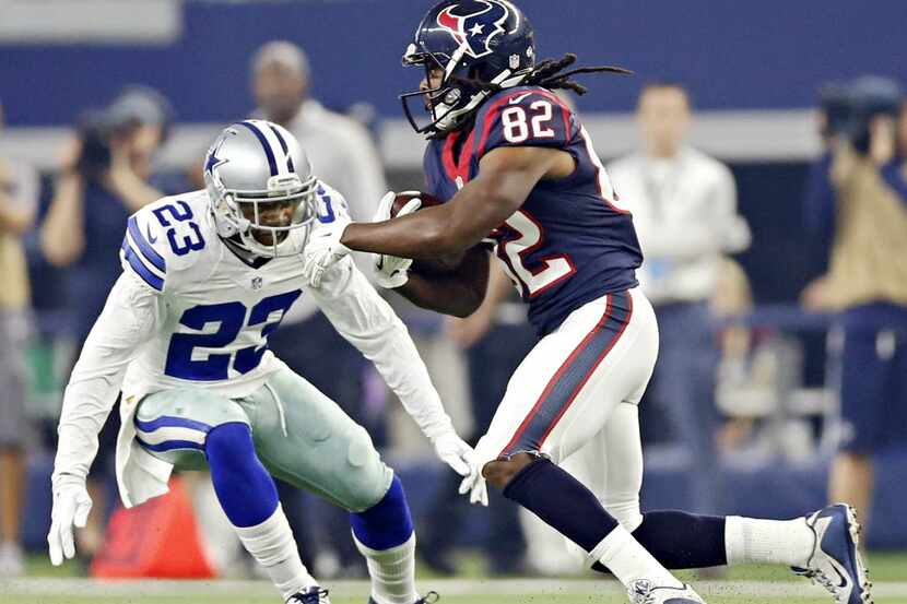 Dallas Cowboys defensive back Corey White (23) tries to tackle Houston Texans wide receiver...