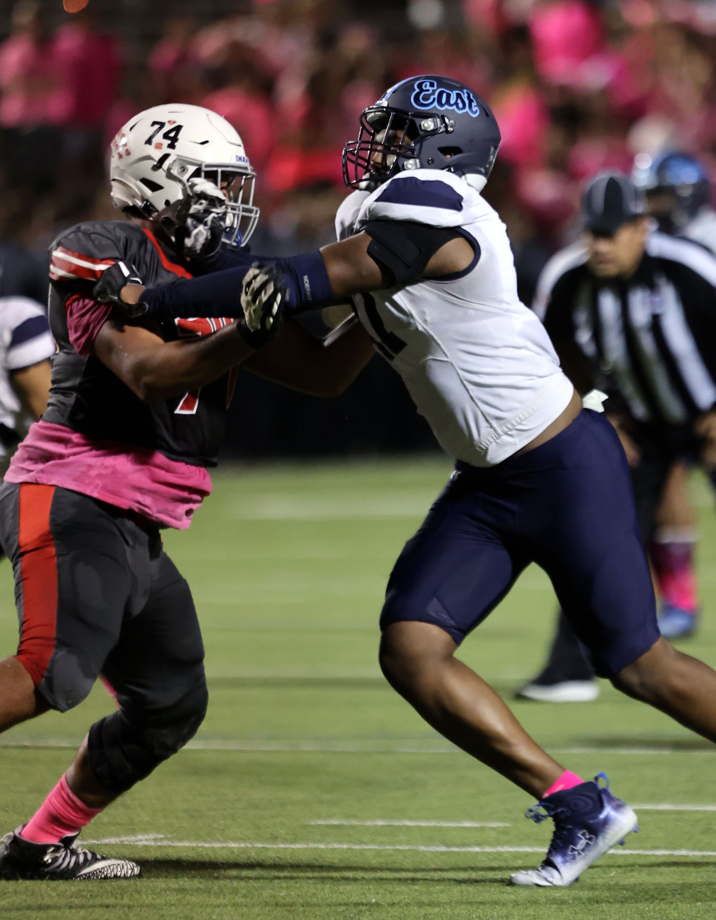 Wylie East high defender Anthony James (47) battles with South Garland high lineman Darwin...