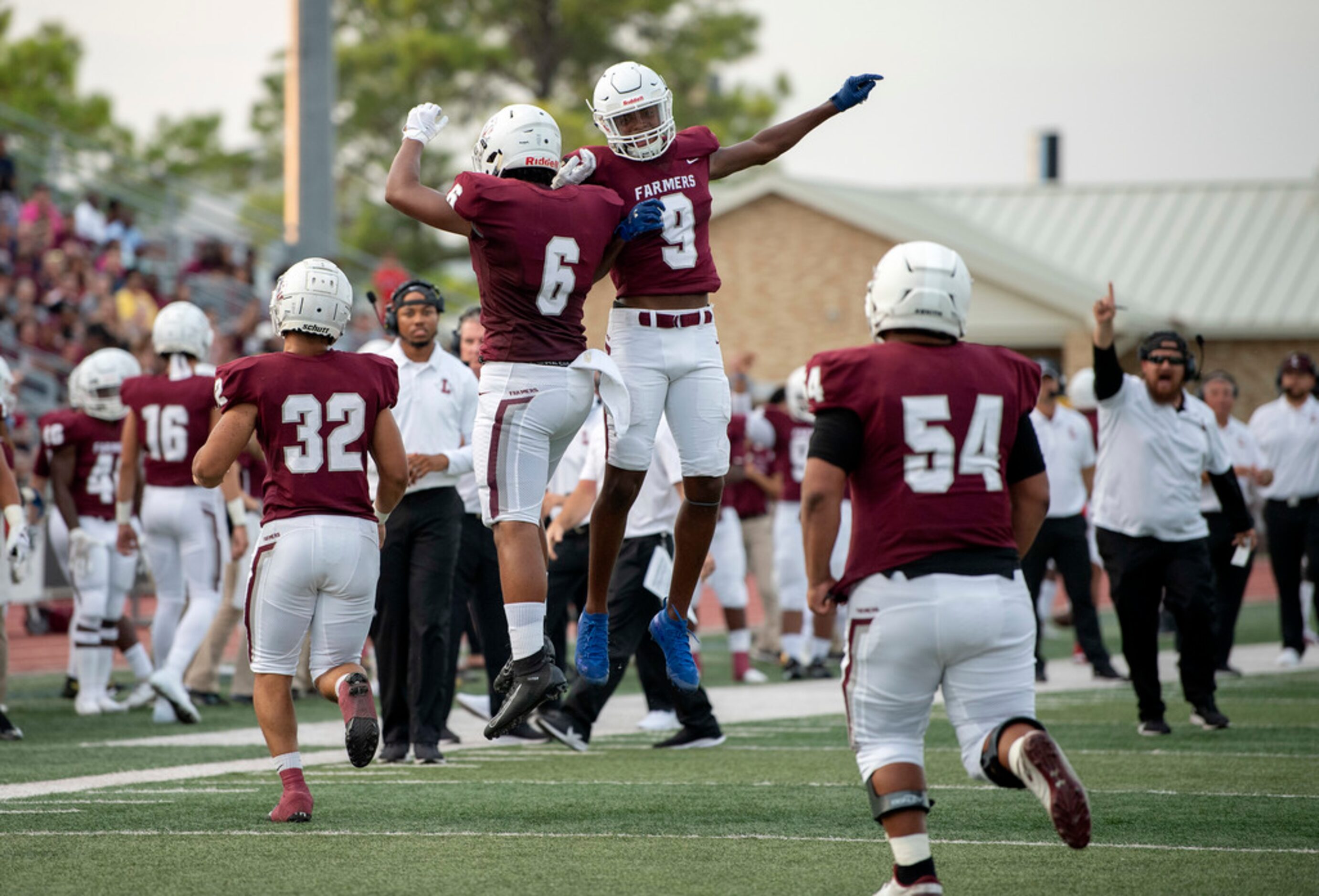 Lewisville sophomore running back Damien Martinez (6) and sophomore wide receiver Armani...