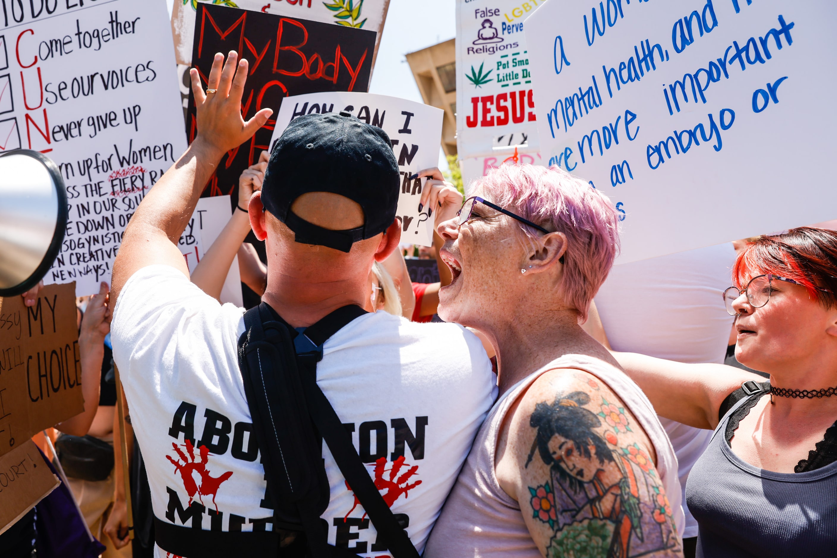 Abortion rights supporters and opponents clash while demonstrating in downtown Dallas on...