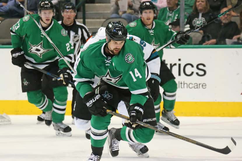Dallas Stars left wing Jamie Benn (14) chases down the puck in the second period during the...