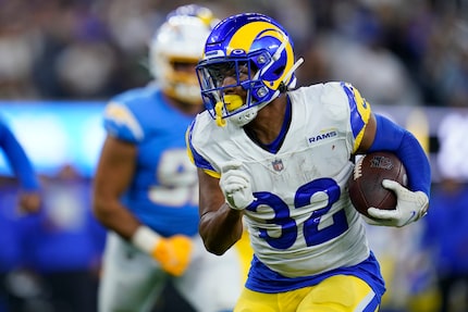 Los Angeles Rams linebacker Travin Howard (32) runs the ball during an NFL football game...