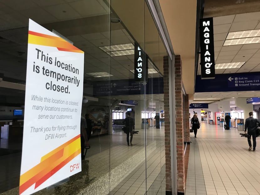 A closed sign on Maggiano's Italian restaurant in DFW's Terminal C on April 9, 2020. Only a...