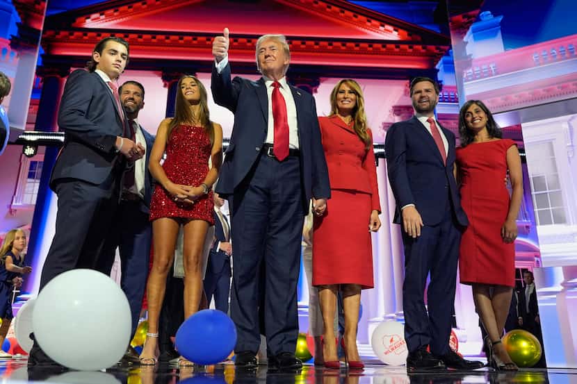 Republican presidential candidate former President Donald Trump stands on stage with former...