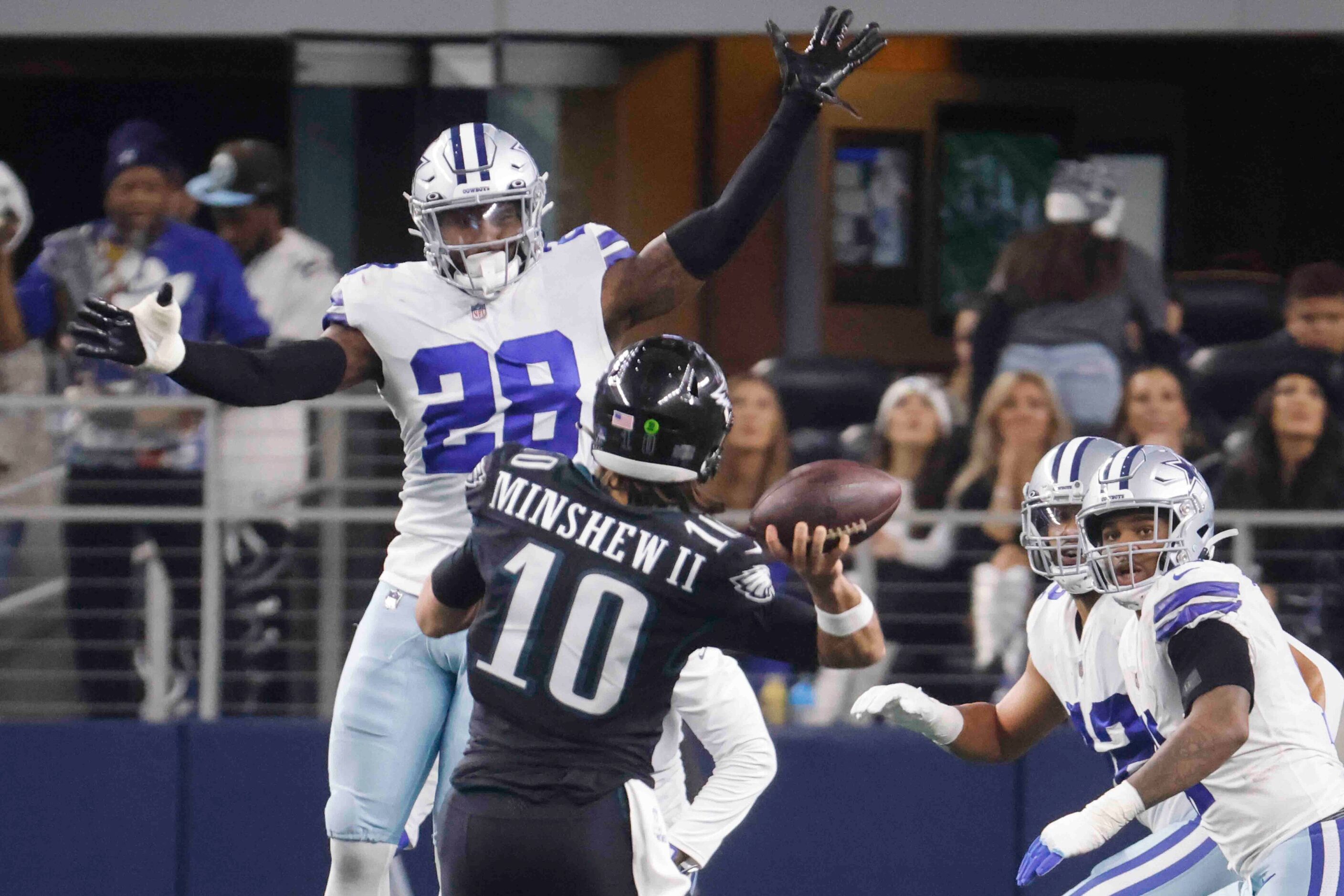 Philadelphia Eagles quarterback Gardner Minshew (10) throws the ball past Dallas Cowboys...