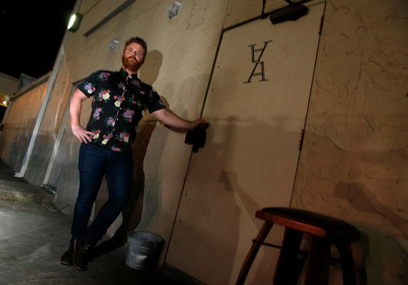 Ricky Cleva, manager, mans the alley door for Atwater Alley speakeasy in Dallas on March 24,...