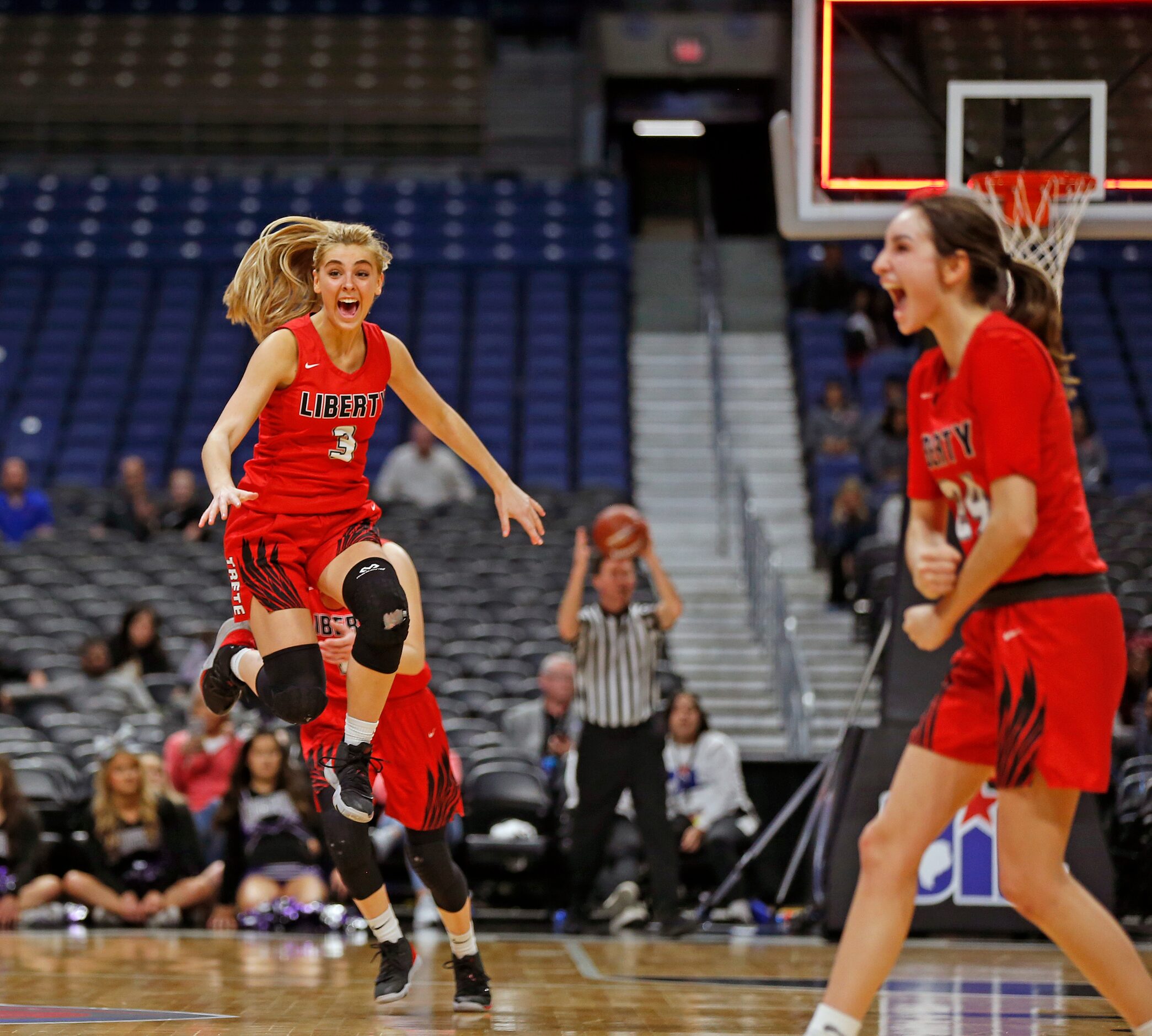 Frisco Liberty guard Lily Ziemkiewicz #3 celebrates as the clock runs out in a 5A semifinal...