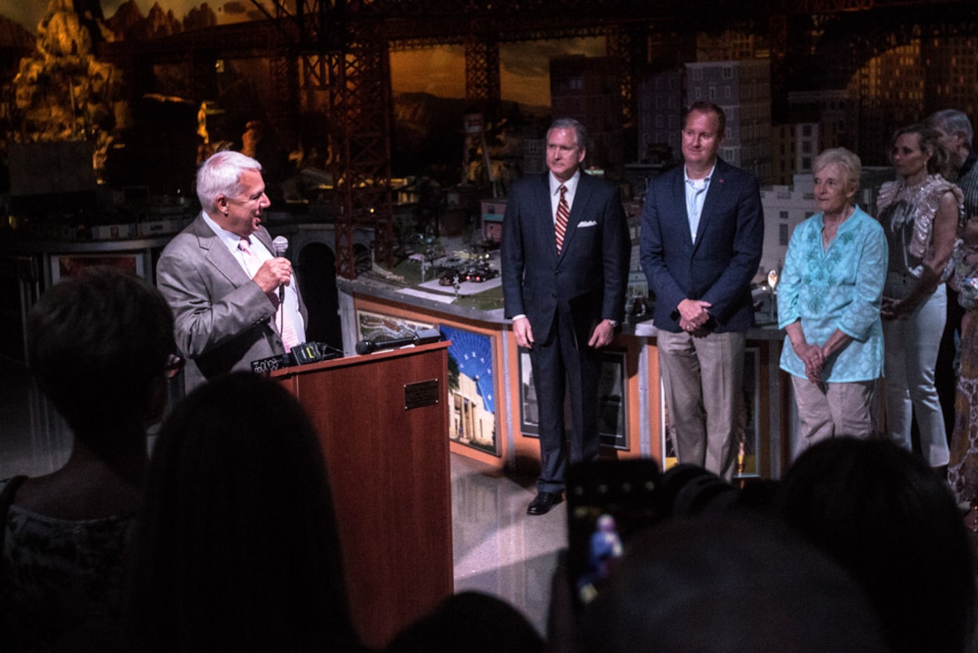 Bob LaPrelle, president and CEO of the Museum of the American Railroad, (left) speaks during...