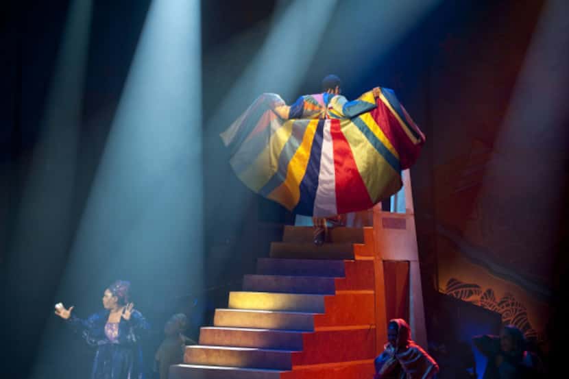 Joseph (Sydney James Harcourt) shows off his coat of many colors during a fashion show scene...
