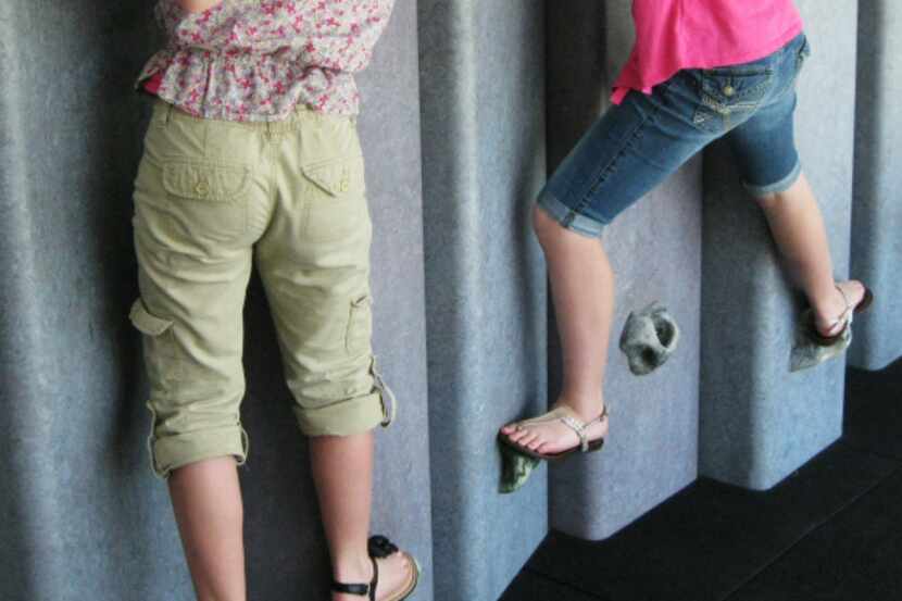 Two girls at the Children's Discovery Museum of the Desert, Rancho Mirage, Calif., test...