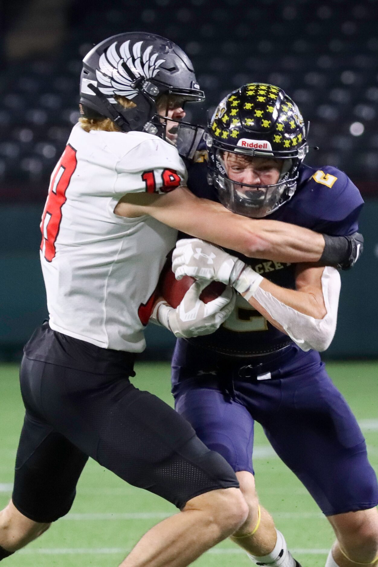 Argyle defensive back Rand Nash (18) tackles Stephenville wide receiver Coy Eakin (2) during...