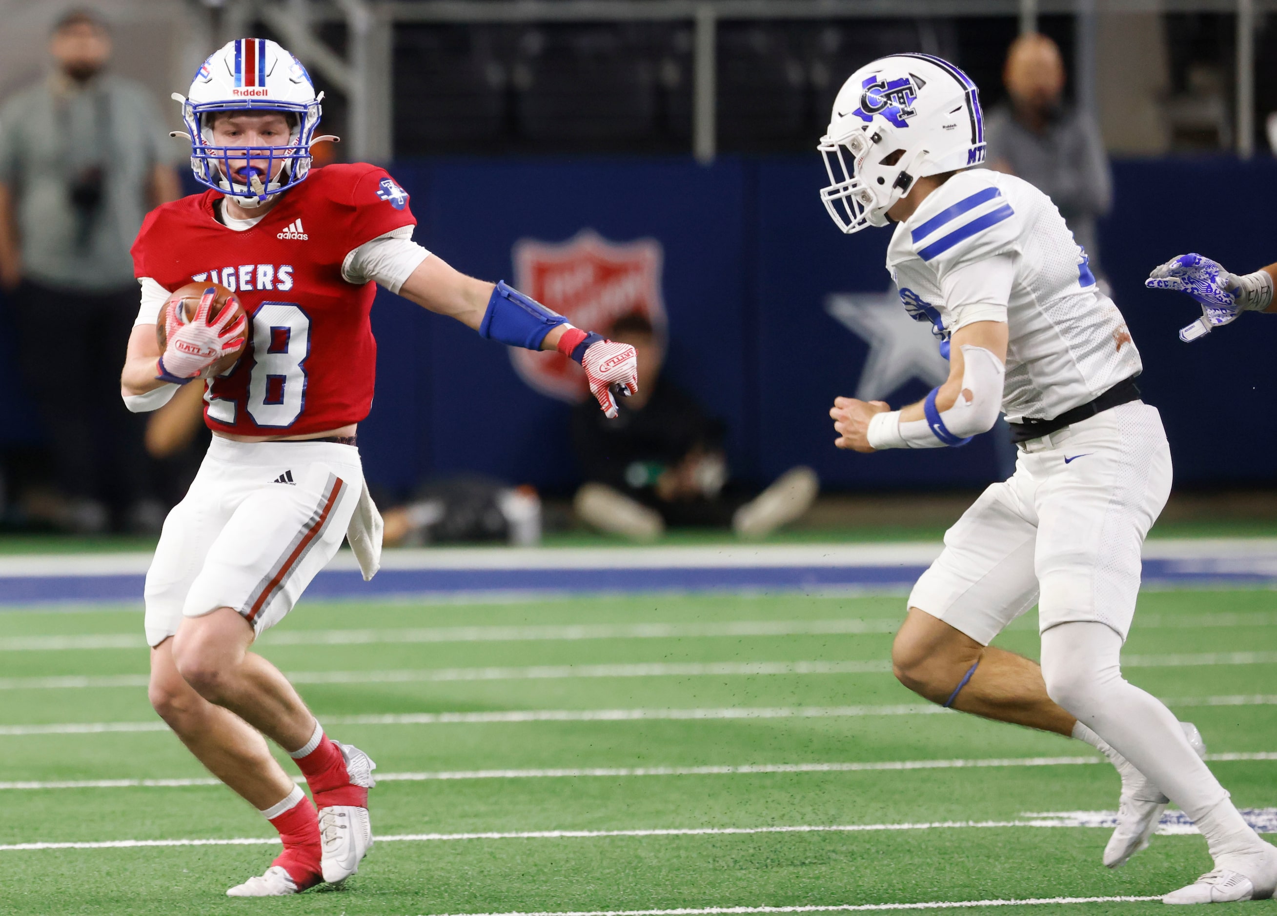 El Maton Tidehaven’s Connor Claxton (left) runs past Gunter High’s Cam Doty during the...