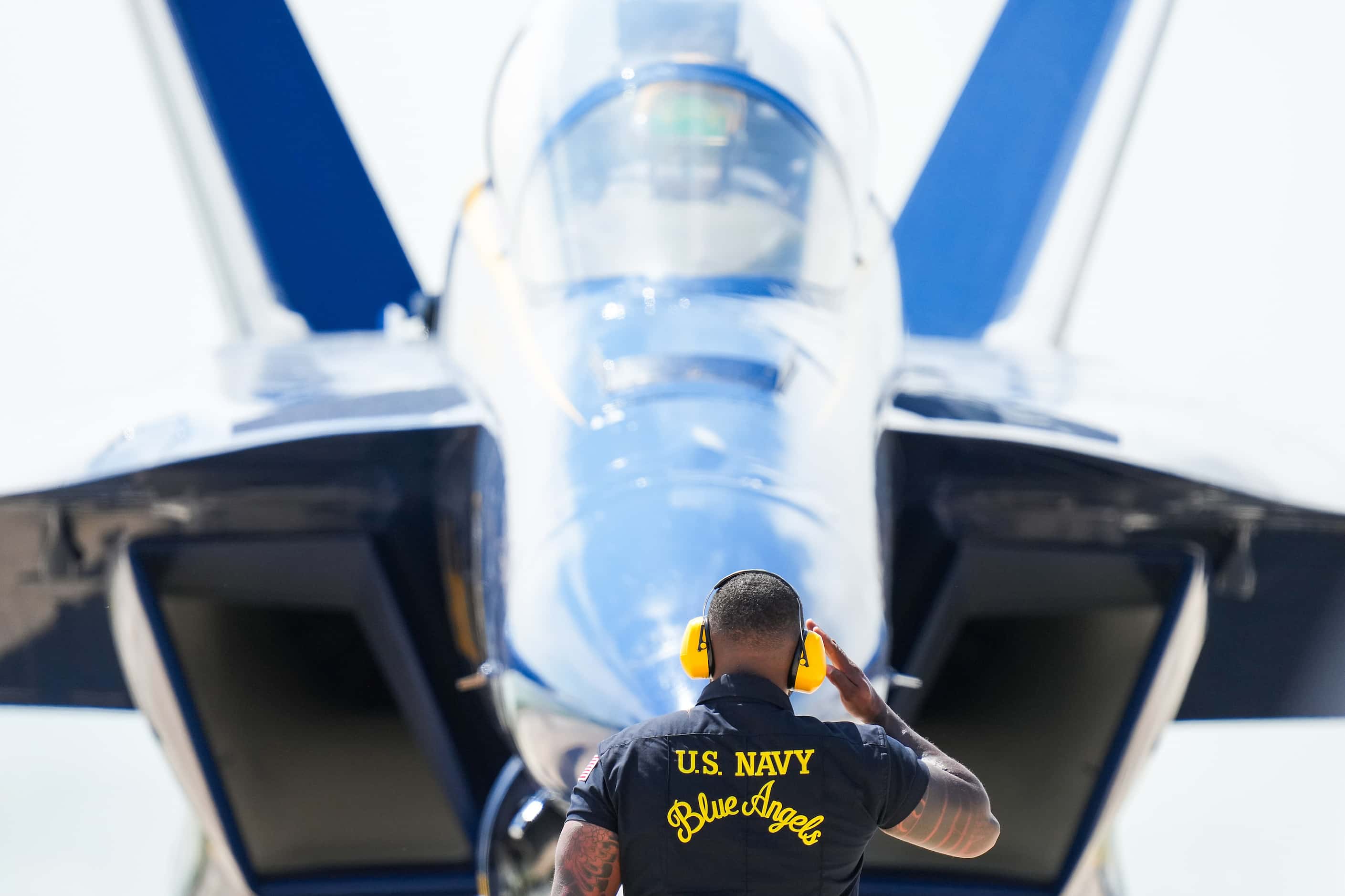 Crew Chief Michael Patterson III salutes Cmdr. Thomas Zimmerman as the Blue Angels prepare...