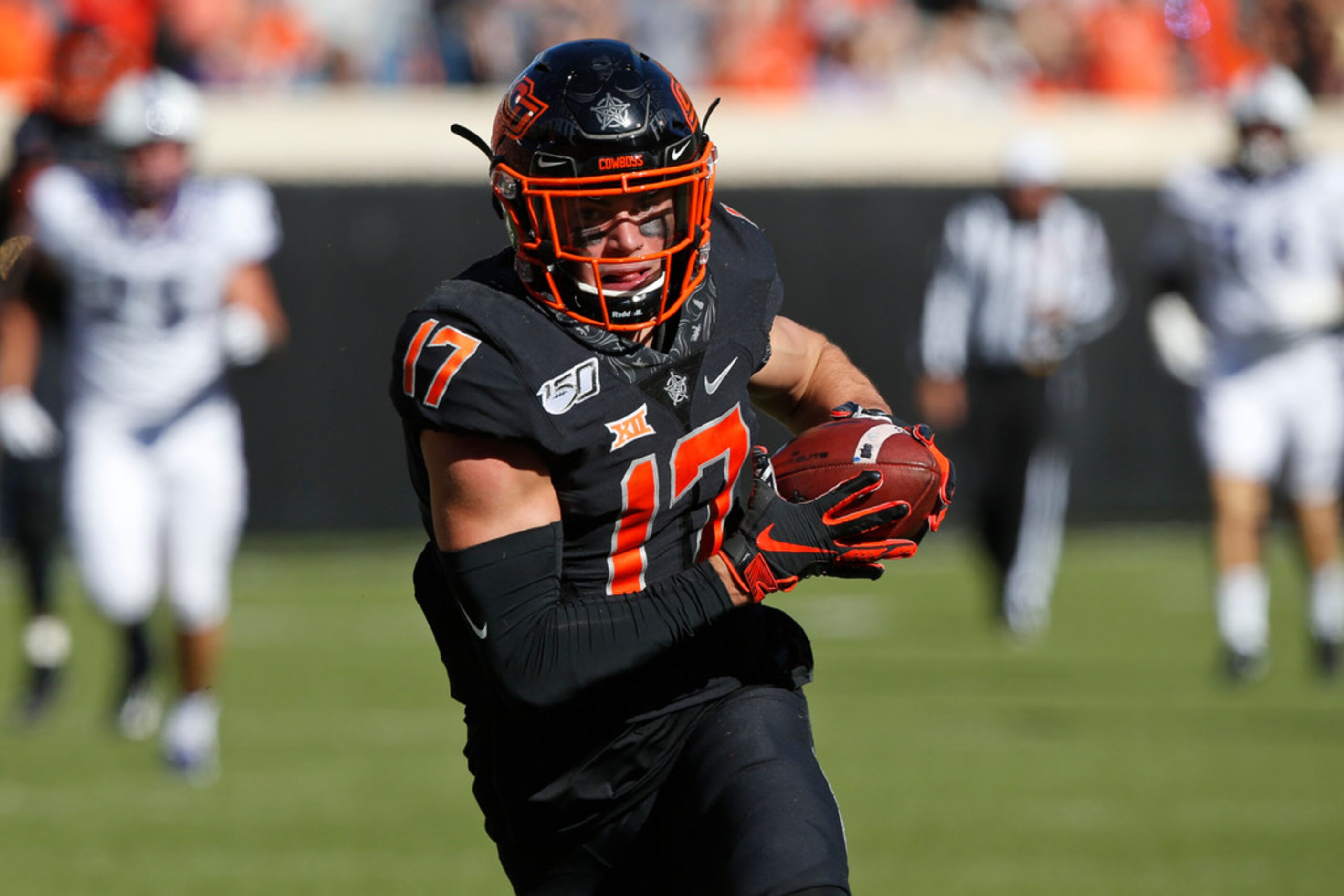 Oklahoma State wide receiver Dillon Stoner (17) runs into the end zone with a touchdown in...