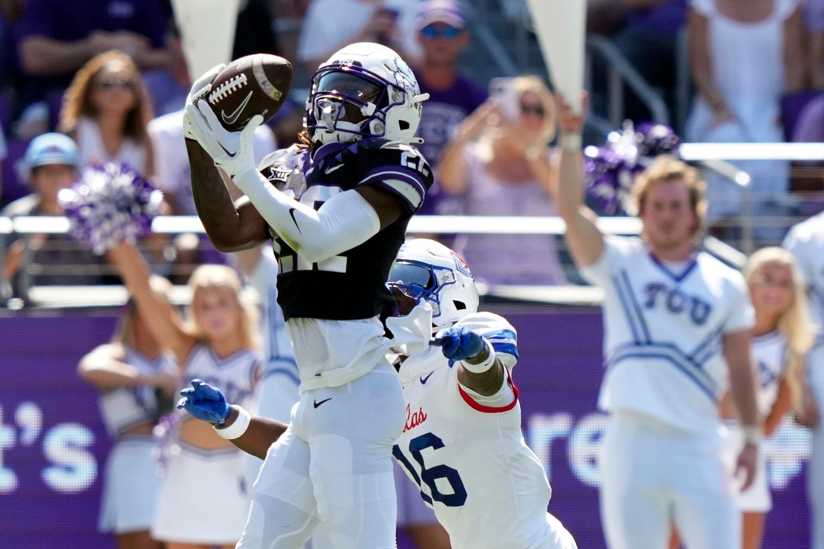 TCU wide receiver Major Everhart (22) catches a pass in front of SMU safety Ahmaad Moses...