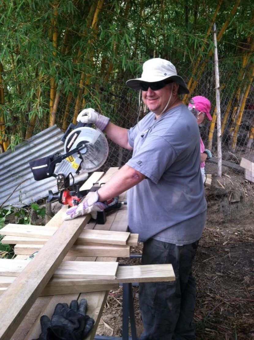 FRANK MERCER ,   pastor   of Rolling Hills Baptist in Georgia, ran the saw for volunteers...