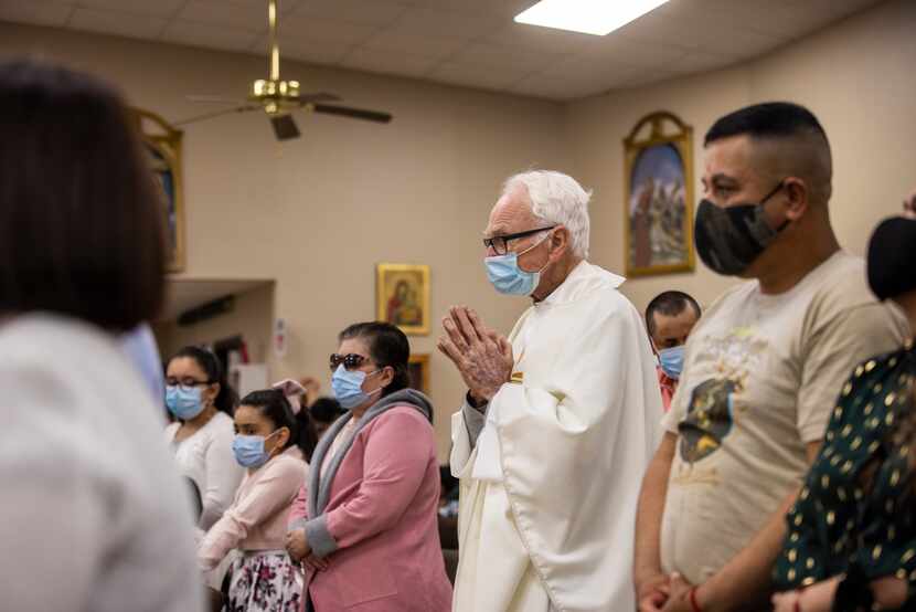 Father Tim proceeds to the sanctuary of Corpus Christi Catholic Parish to deliver a Spanish...