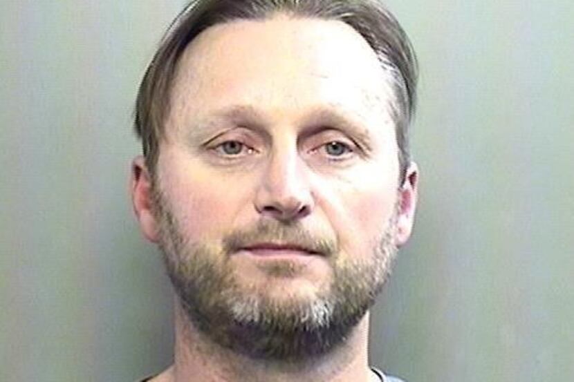 Michael Queen, 44, was arrested Jan. 30 in Arlington after police say they found him digging...