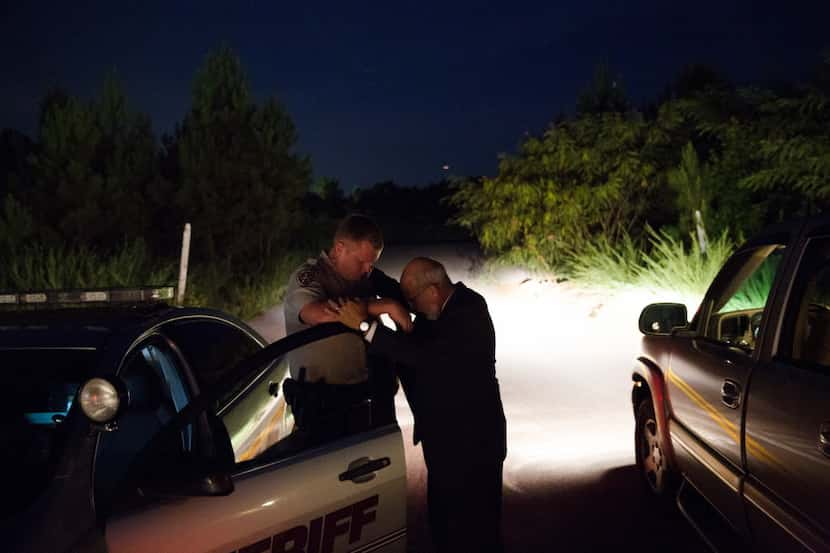 Dwayne Hewett, a Baptist pastor, pulled over to pray with deputy Matt Stachowicz in Paulding...