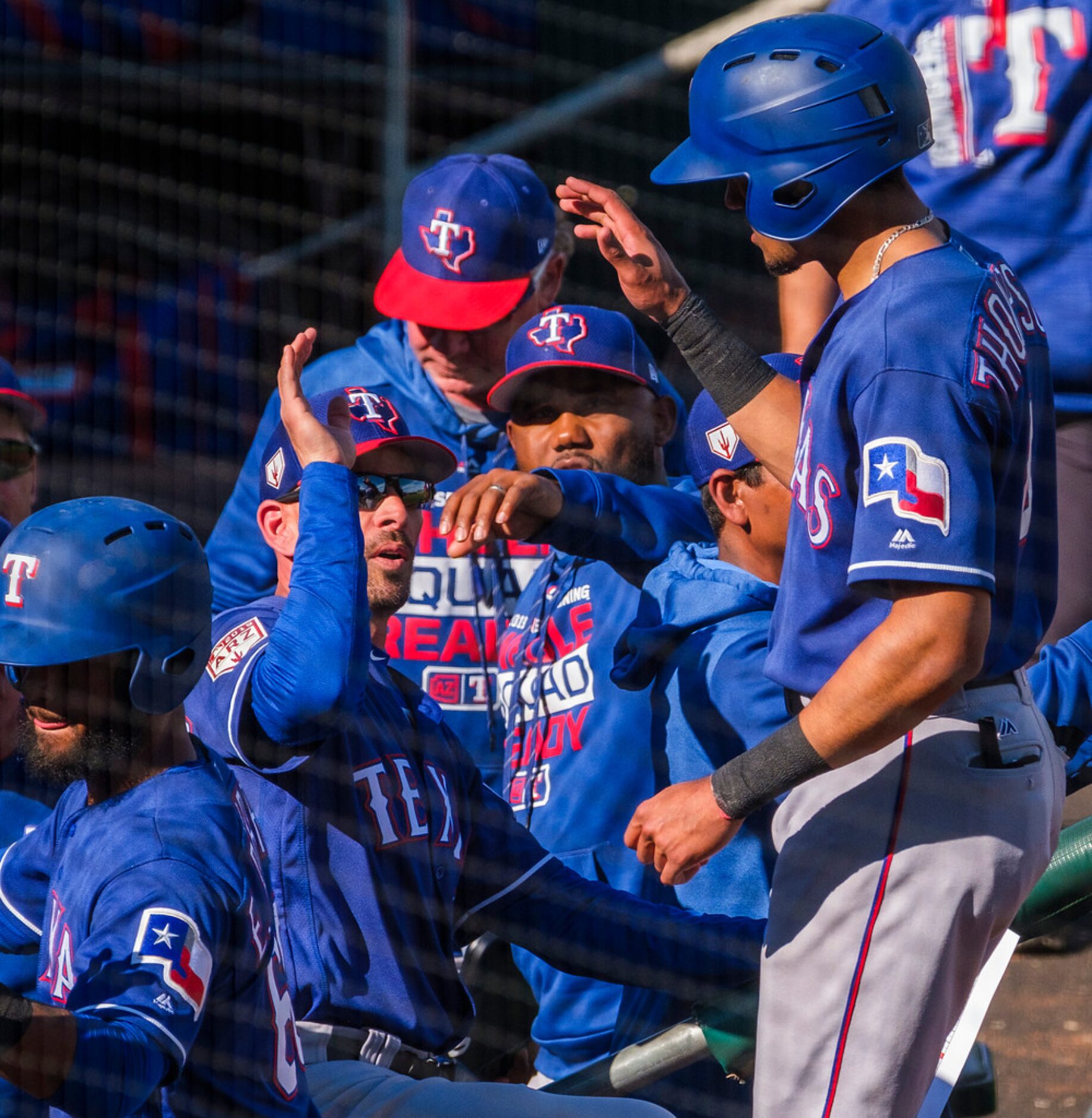 Texas Rangers outfielder Bubba Thompson is congratulated by manager Chris Woodward after...