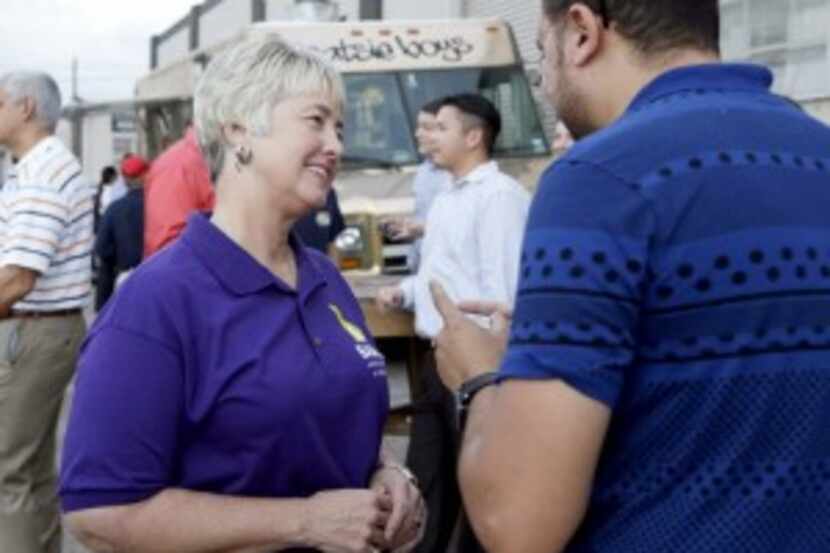  Houston Mayor Annise Parker, left, greets a supporter at a fund raiser for the Houston...