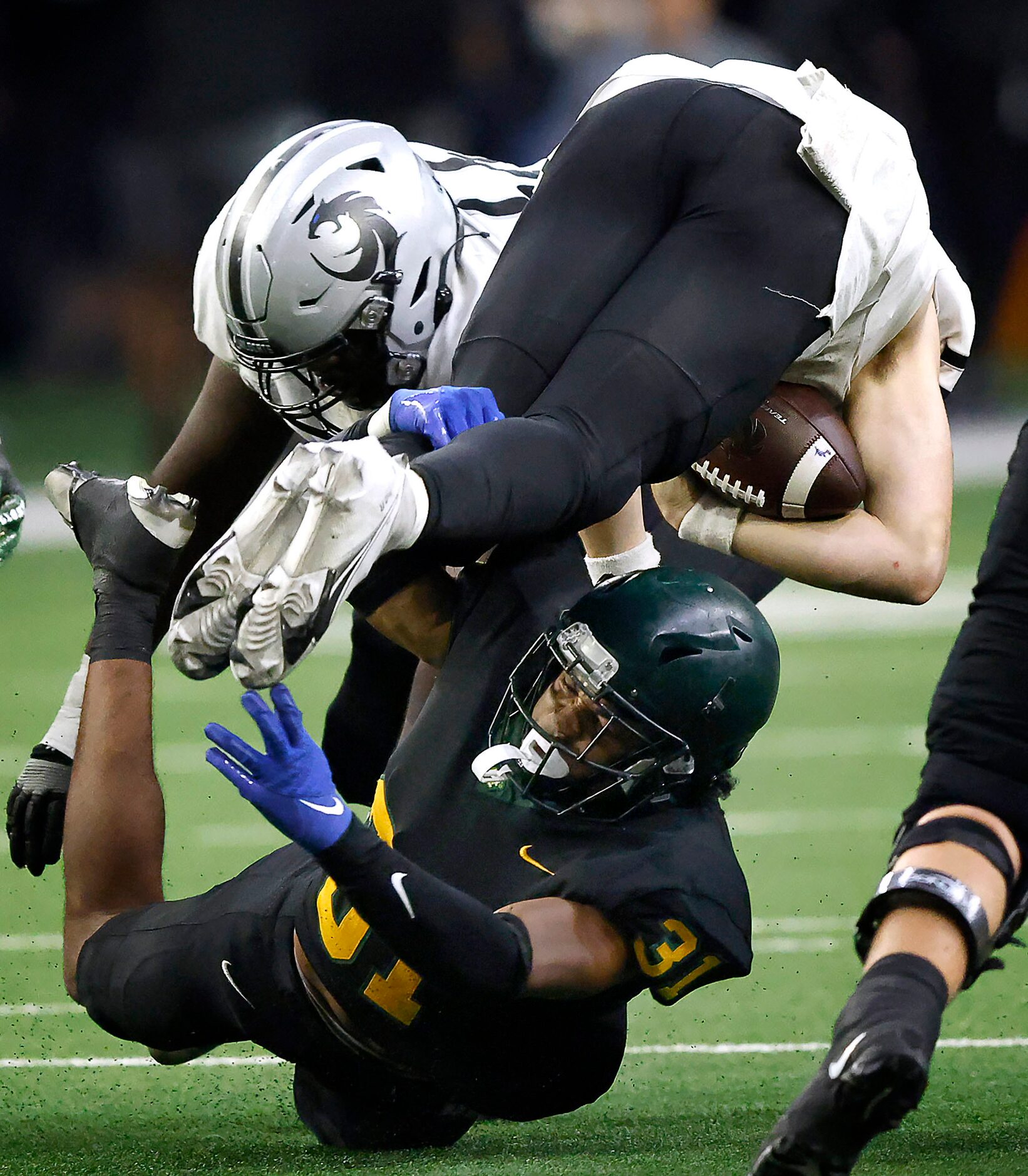 DeSoto outside linebacker Brandon Booker (31) tackles Denton Guyer quarterback Jackson...