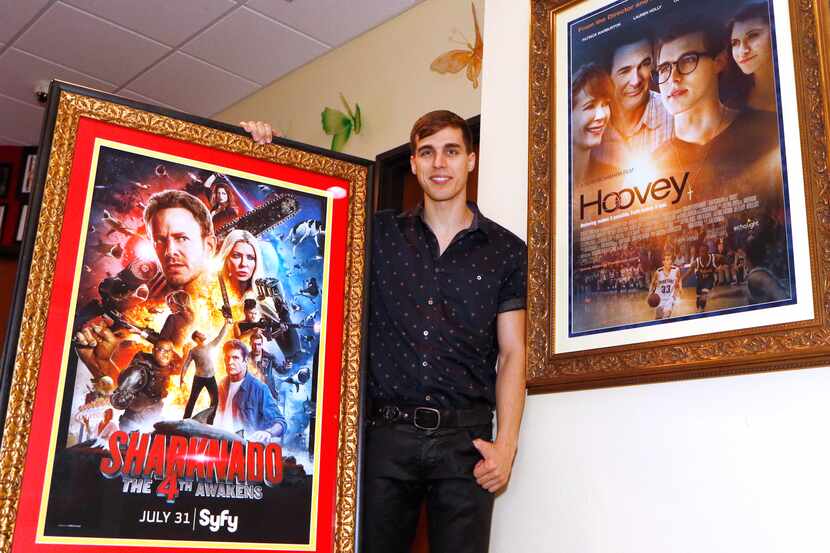 Cody Linley poses between two movie posters that he was part of at Cathryn Sullivan's...