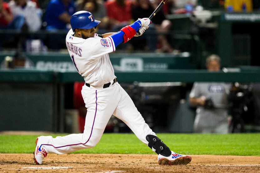 Texas Rangers shortstop Elvis Andrus (1) hits a home run during the fifth inning of an MLB...