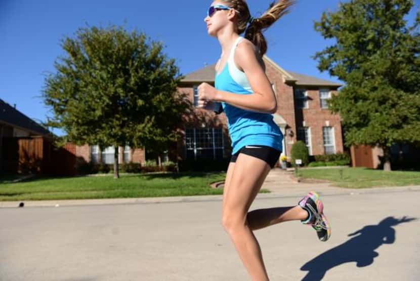 Ariana Luterman  runs down the street of her North Dallas neighborhood.