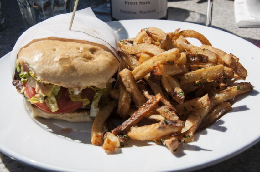 Ajax Double Cheeseburger at Ajax Tavern in Aspen starts with two thin patties of beef from...