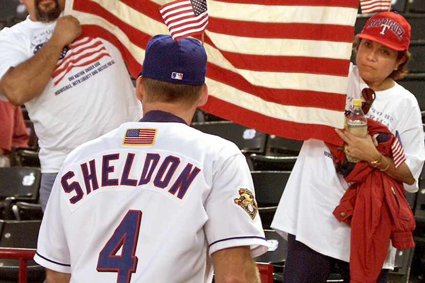  September 18, 2001-- Josef and Maria Rodriguez hold an American flag as they talk with...