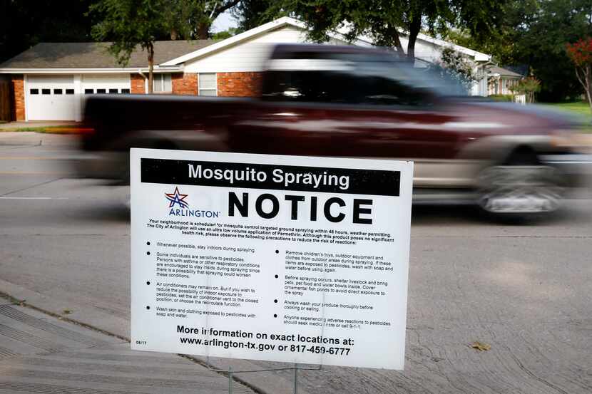 A City of Arlington yard sign alerts drivers and residents in North Arlington of mosquito...