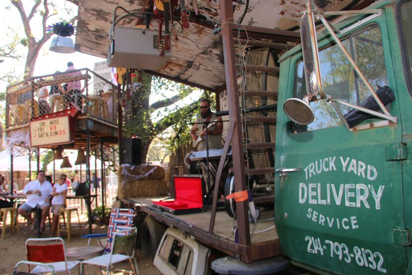 The Truck Yard in Dallas has mis-matched chairs and picnic tables strewn about its backyard....