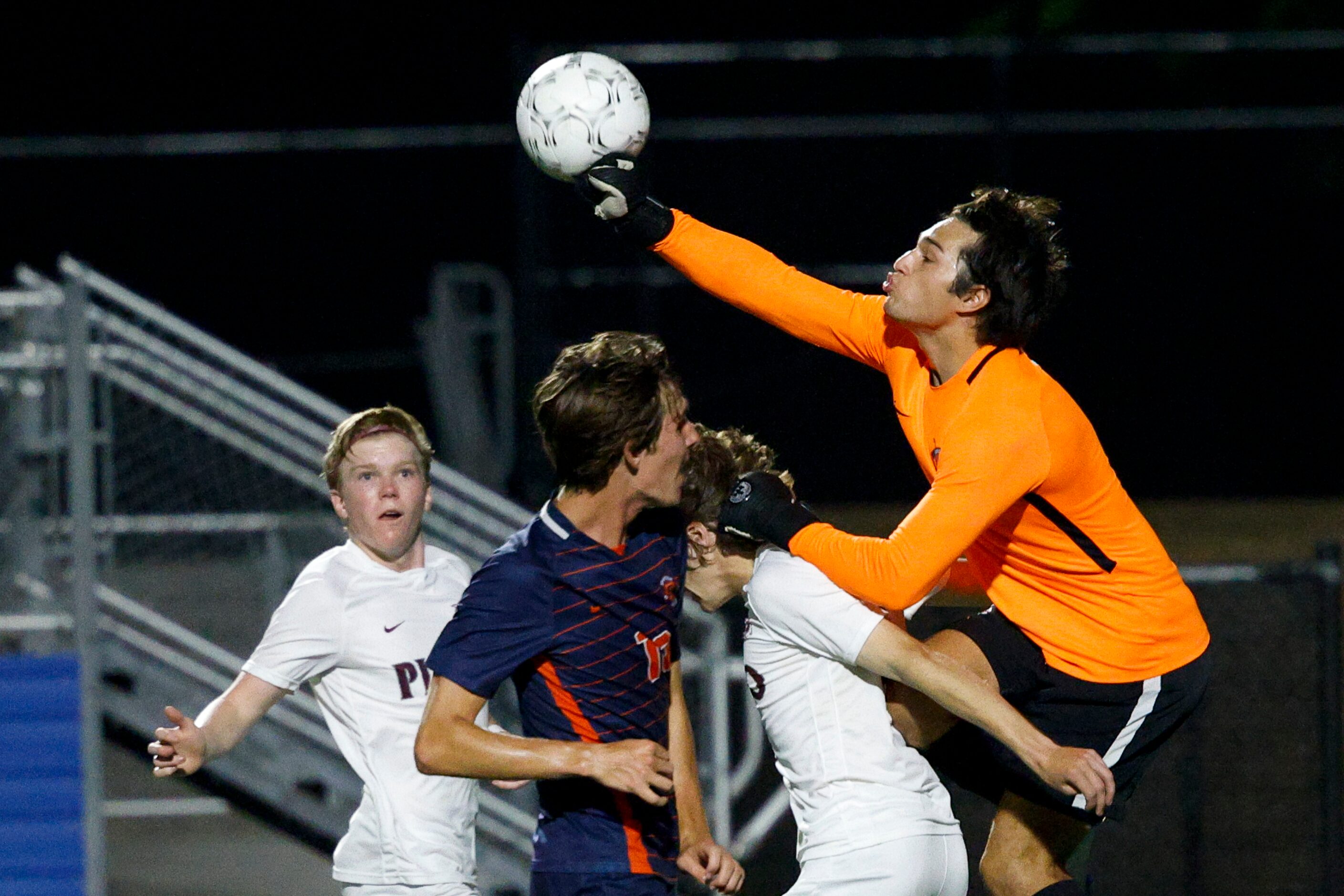 Katy Seven Lakes goalkeeper Anthony Gonzalez (1) collides with Plano forward Aaron Myers...