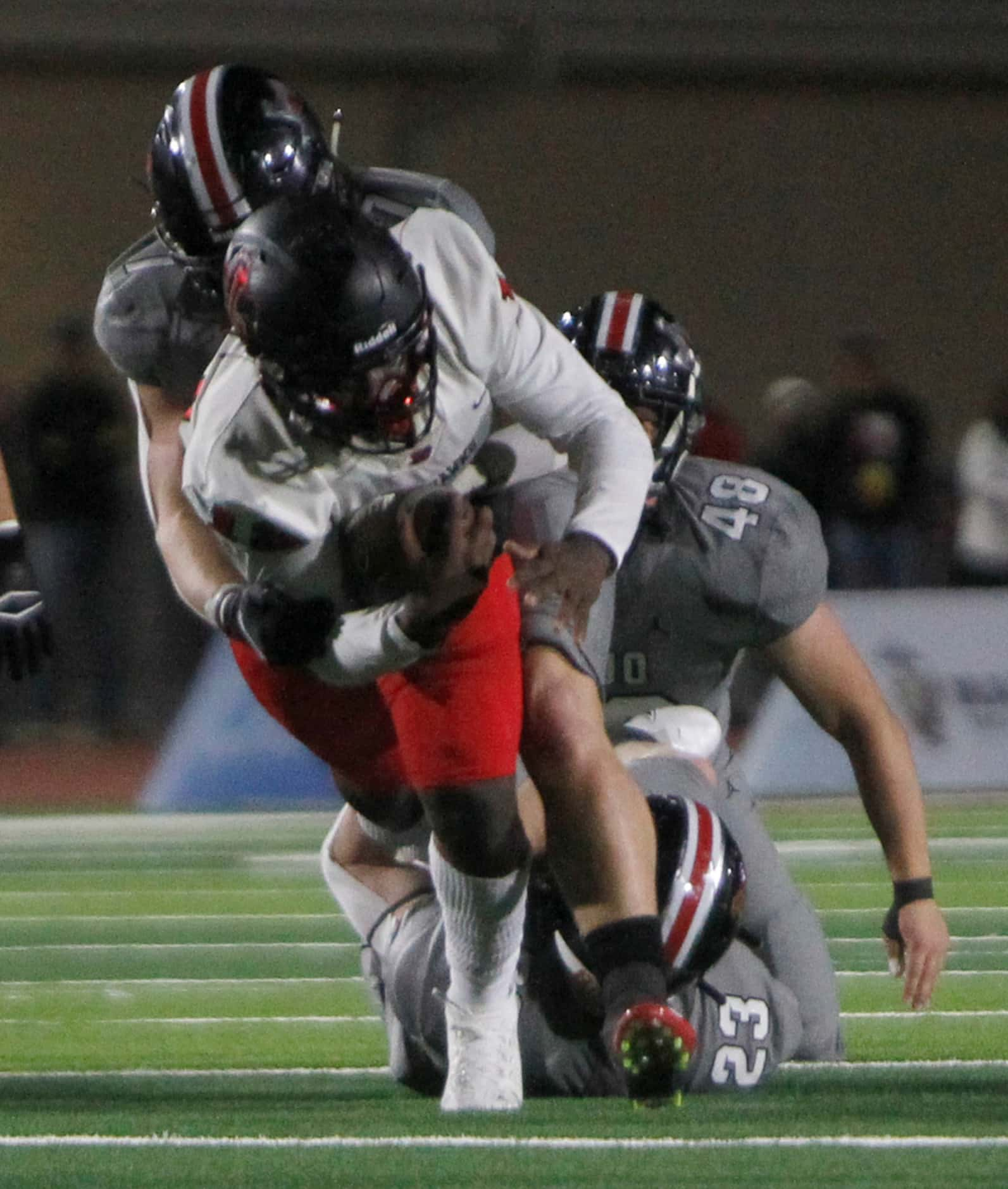 Frisco Liberty quarterback Keldric Luster (12) rambles into the Lucas Lovejoy secondary as...