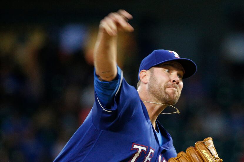 Texas Rangers starting pitcher Colby Lewis (48) pitches against Tampa Bay Rays in the first...