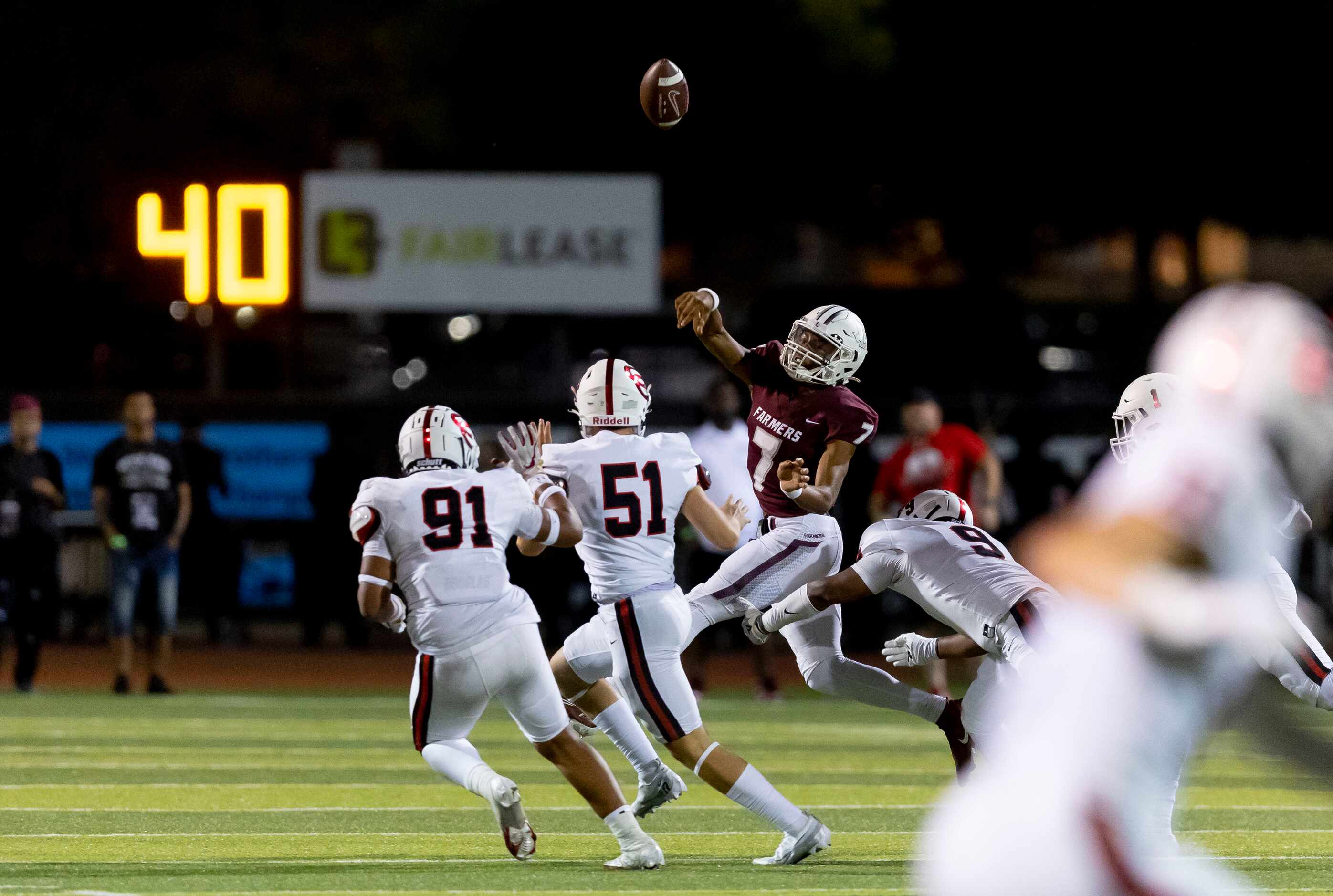 Lewisville junior quarterback Ethan Terrell (7) throws under pressure from the Coppell...