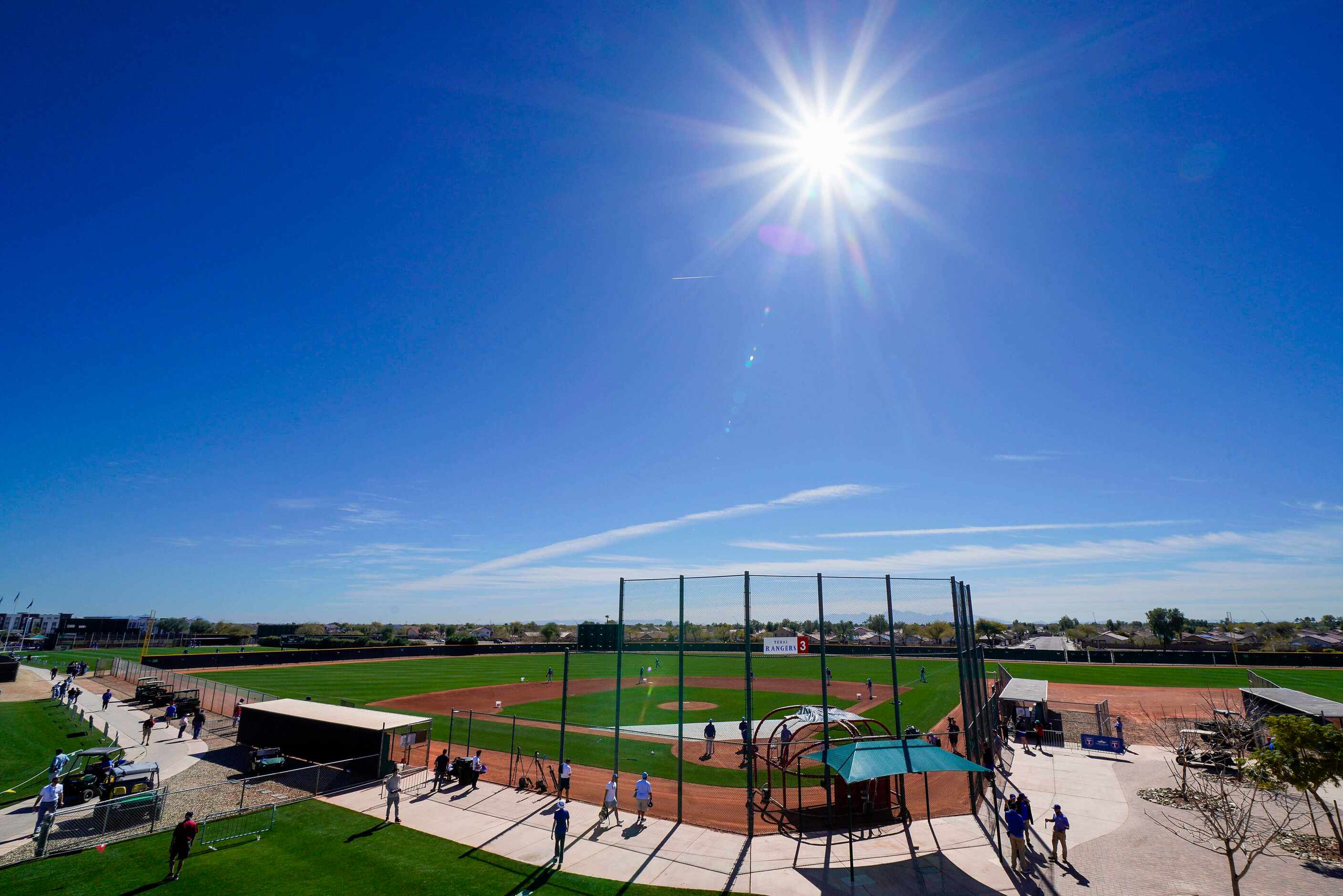 Clear skies and sunshine provide the backdrop for the Texas Rangers first full squad spring...