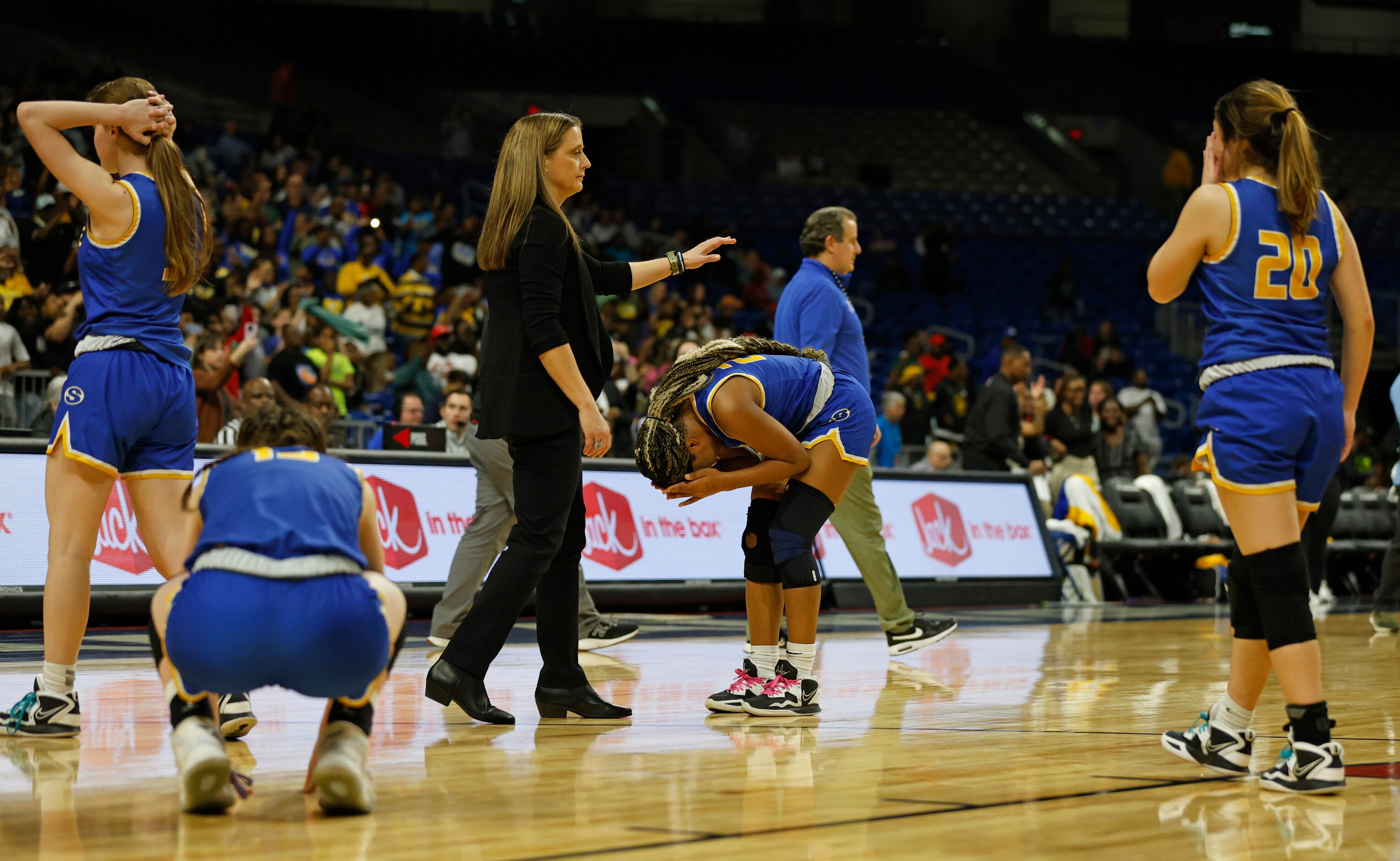 Sunnyvale head coach Jill McDill comes over to console Sunnyvale Sidney Williams (5) in...