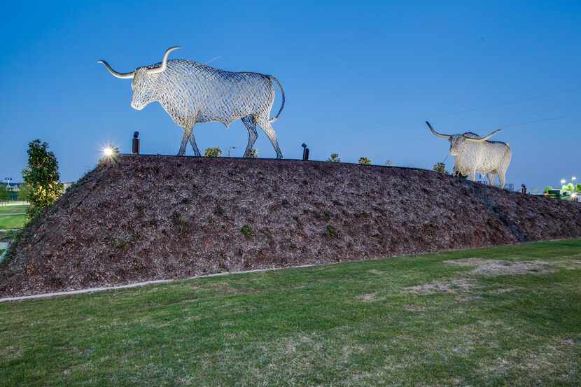 
Two sculptures flank the Cypress Waters entrance on Belt Line Road. The 16-foot high metal...