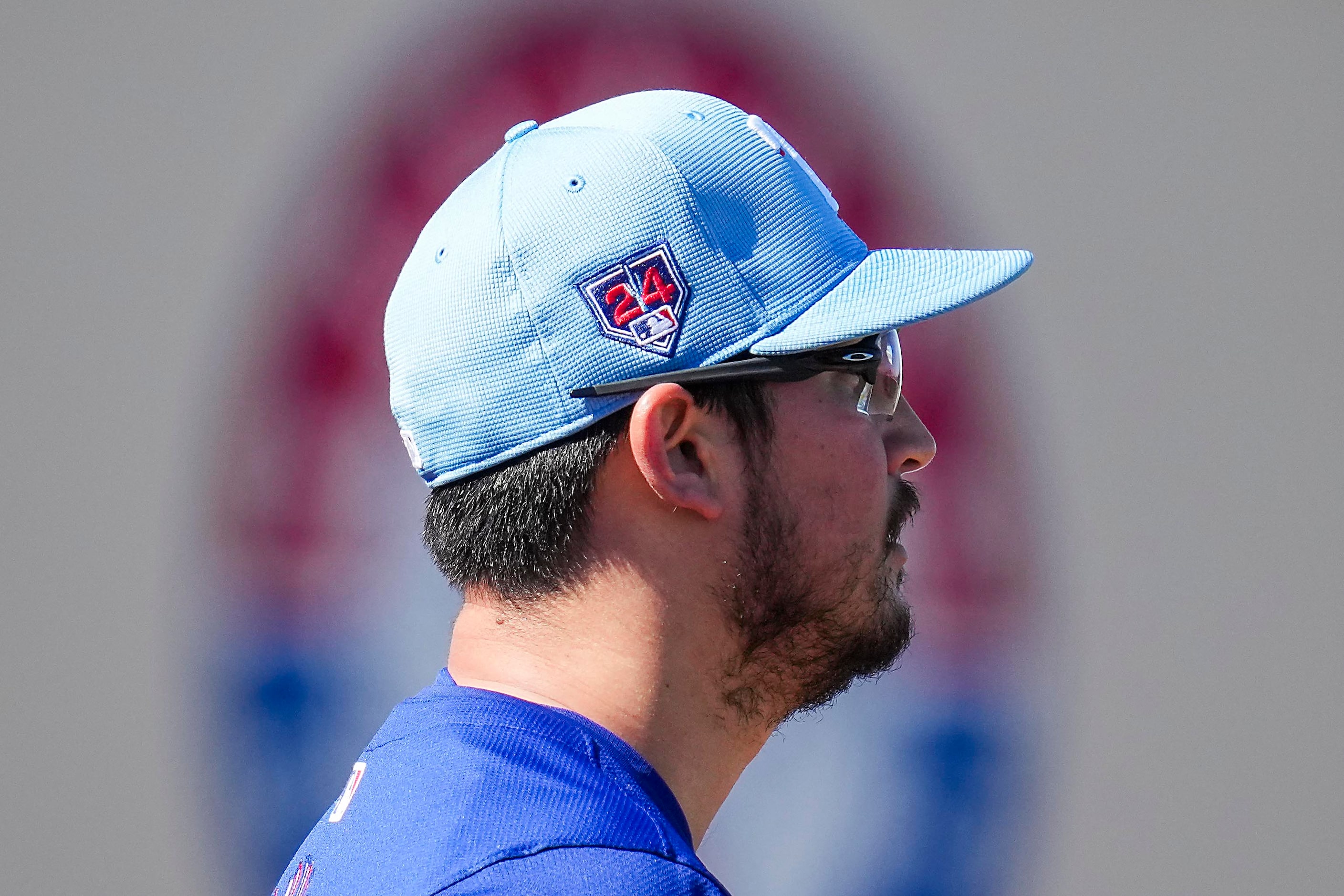 Texas Rangers pitcher Dane Dunning prepares to throw a bullpen session aduring the first...