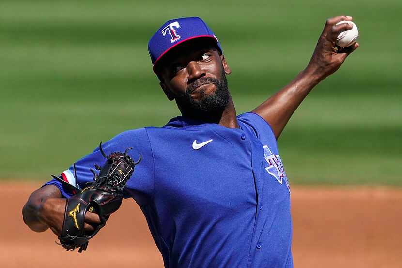 Texas Rangers pitcher Taylor Hearn delivers during the second inning of a spring training...