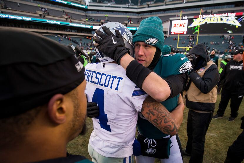 Philadelphia Eagles quarterback Nick Foles hugs Dallas Cowboys quarterback Dak Prescott...