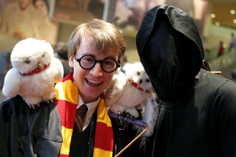 David Helms as Harry Potter, and Alec May as Hedwig the Owl are among the fans waiting in...