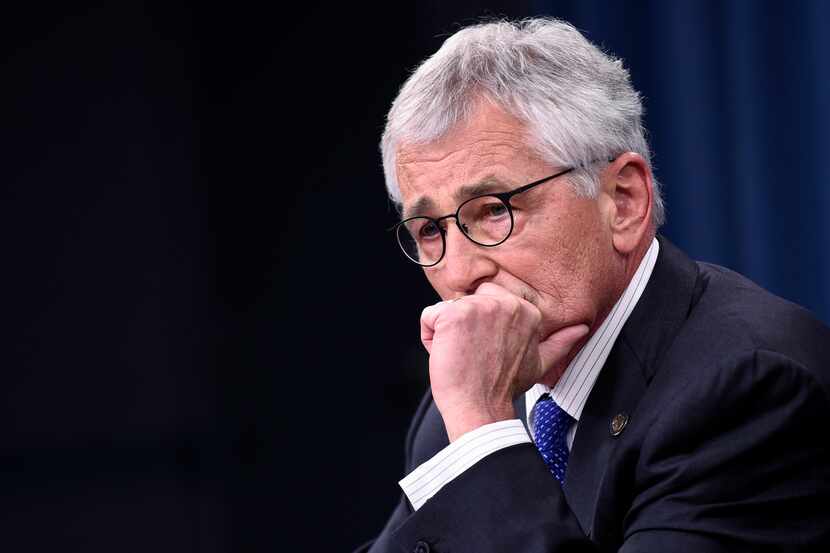 FILE - In this Thursday, Oct. 30, 2014, file photo, Defense Secretary Chuck Hagel listens to...