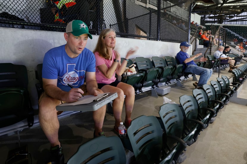 Season ticket holders Dallas Brewton, of Albuquerque, NM and  Pam Lunk of Arlington, watch...