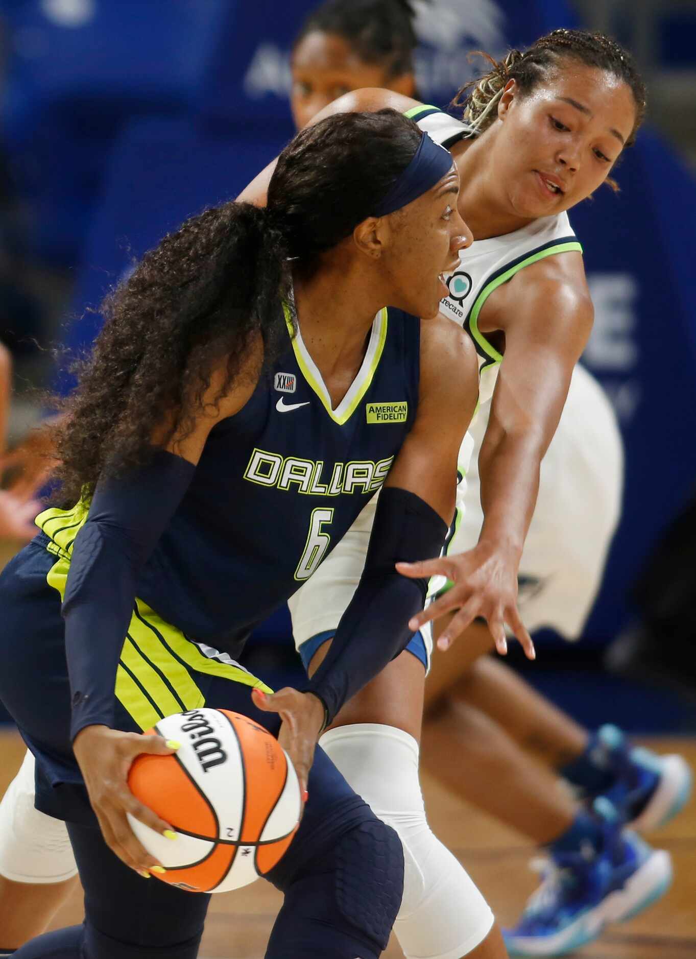 Dallas Wings forward Kayla Thornton (6) looks to pass as she is defended by Minnesota Lynx...