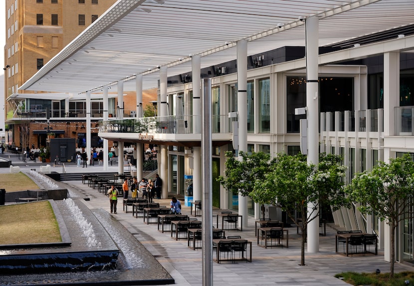 Steel trellises cover the outdoor dining area of the The Exchange food hall in the new AT&T...